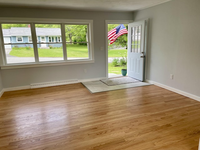 10 Crawford Dr, Bath, ME 04530 - foyer featuring baseboard heating, light wood-style floors, and baseboards