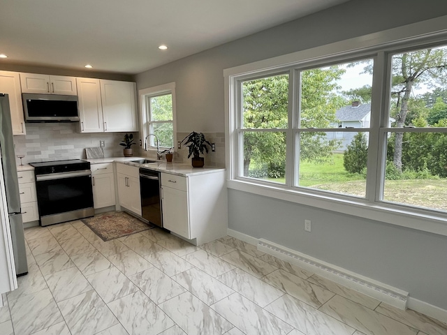 10 Crawford Dr, Bath, ME 04530 - kitchen with stainless steel appliances, a baseboard radiator, a sink, plenty of natural light, and recessed lighting