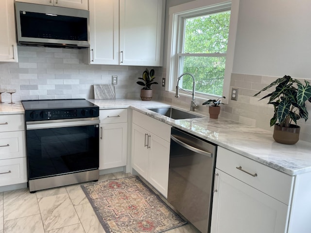 10 Crawford Dr, Bath, ME 04530 - kitchen featuring appliances with stainless steel finishes, a sink, white cabinets, and light marble finish floors