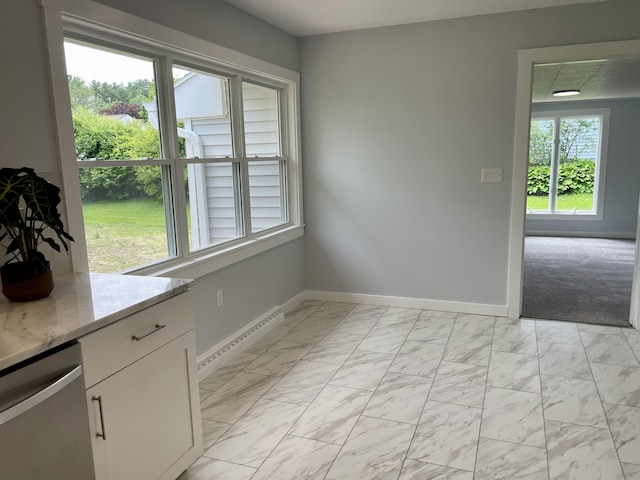 10 Crawford Dr, Bath, ME 04530 - unfurnished dining area featuring baseboards, light marble finish flooring, and baseboard heating