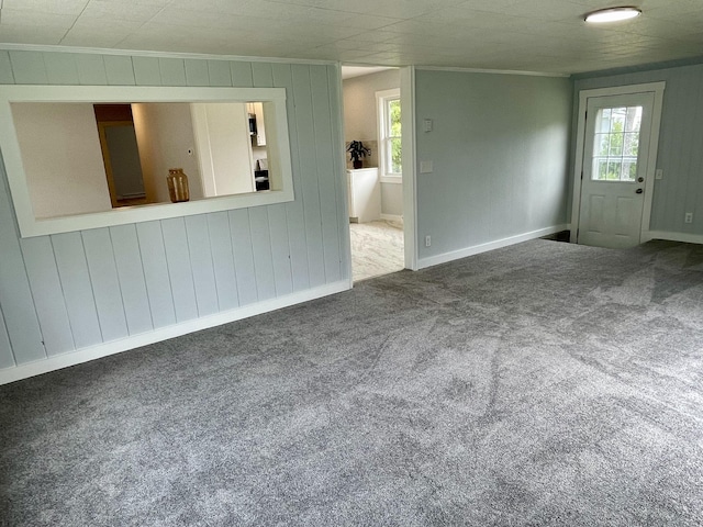 10 Crawford Dr, Bath, ME 04530 - empty room with ornamental molding, carpet flooring, baseboards, and wood walls