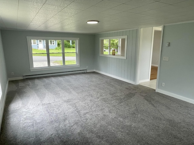 10 Crawford Dr, Bath, ME 04530 - empty room featuring a baseboard heating unit, carpet floors, and baseboards