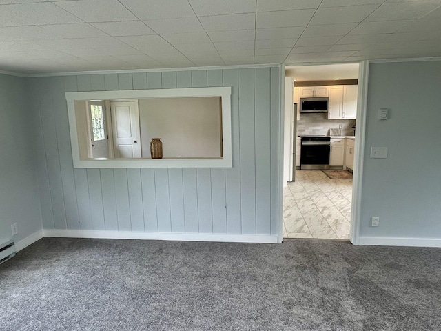 10 Crawford Dr, Bath, ME 04530 - spare room with crown molding, light colored carpet, baseboards, and wood walls