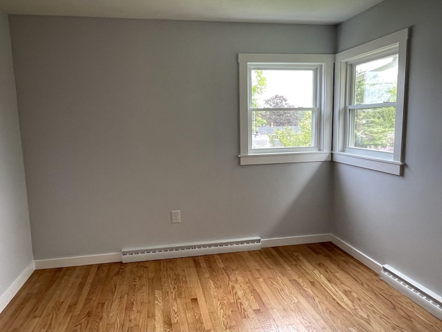 10 Crawford Dr, Bath, ME 04530 - unfurnished room featuring baseboard heating, plenty of natural light, and light wood-style flooring