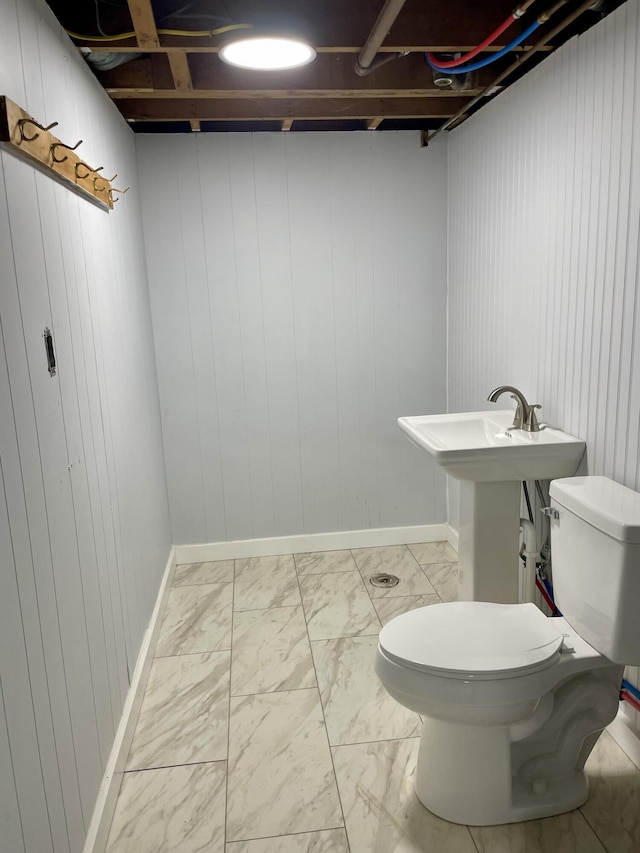 10 Crawford Dr, Bath, ME 04530 - bathroom featuring toilet, marble finish flooring, baseboards, and wooden walls
