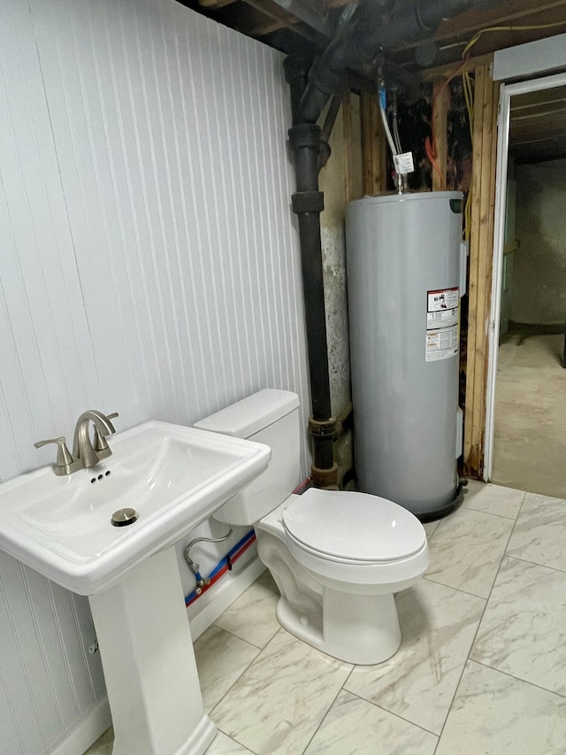 10 Crawford Dr, Bath, ME 04530 - half bathroom with water heater, toilet, marble finish flooring, and a sink