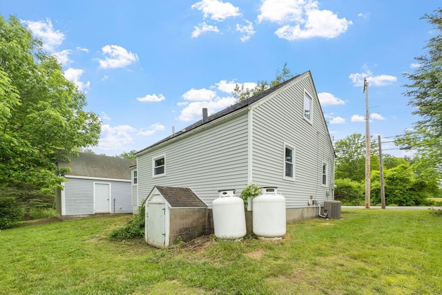 156 Lebanon Rd, North Berwick, ME 03906 - view of side of property featuring a lawn and central AC unit