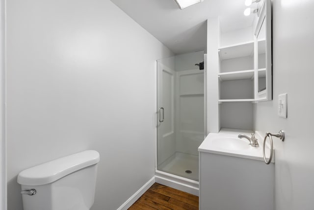 156 Lebanon Rd, North Berwick, ME 03906 - full bath with baseboards, a stall shower, vanity, toilet, and wood finished floors