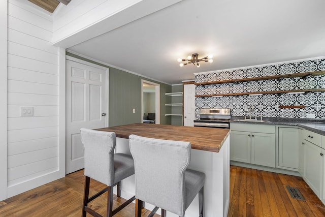 156 Lebanon Rd, North Berwick, ME 03906 - kitchen featuring wooden counters, open shelves, stainless steel electric range, a sink, and a breakfast bar