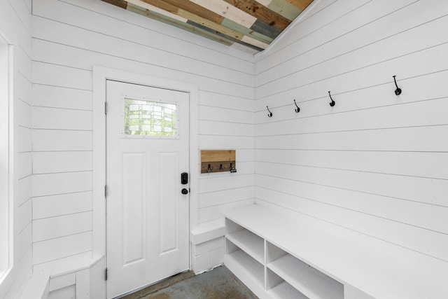 156 Lebanon Rd, North Berwick, ME 03906 - mudroom featuring wooden walls and unfinished concrete flooring