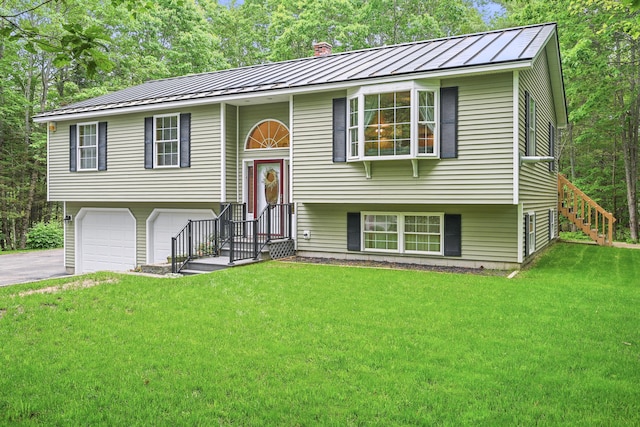 76 Bunny St, Augusta, ME 04330 - bi-level home featuring a standing seam roof, metal roof, a front lawn, and driveway