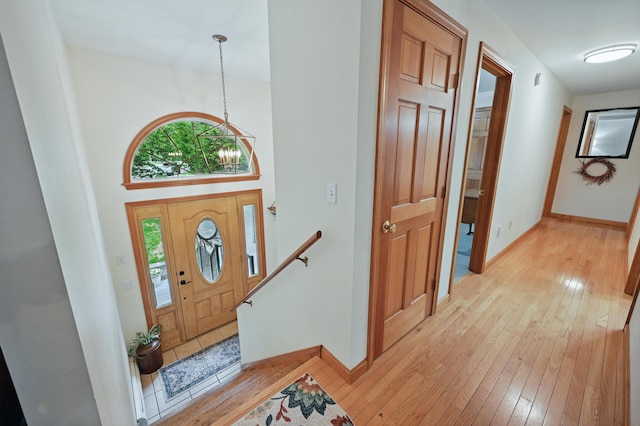 76 Bunny St, Augusta, ME 04330 - foyer entrance with light wood-style floors, baseboards, a chandelier, and a high ceiling