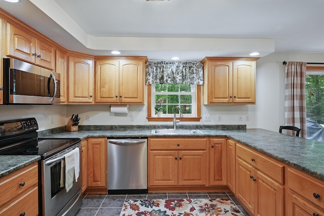 76 Bunny St, Augusta, ME 04330 - kitchen featuring appliances with stainless steel finishes, a sink, recessed lighting, and dark countertops