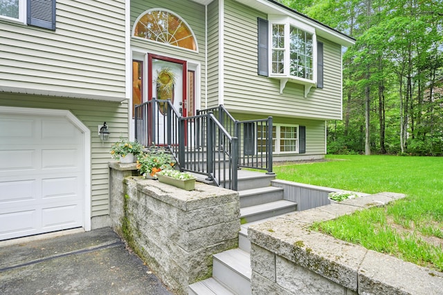 76 Bunny St, Augusta, ME 04330 - doorway to property featuring a yard and an attached garage