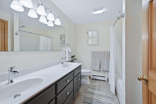 76 Bunny St, Augusta, ME 04330 - full bath with a baseboard radiator, double vanity, tile patterned flooring, and toilet