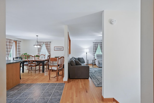 76 Bunny St, Augusta, ME 04330 - living room featuring dark wood-style floors and a chandelier