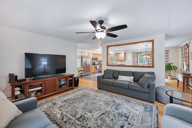 76 Bunny St, Augusta, ME 04330 - living area featuring light wood finished floors and a ceiling fan