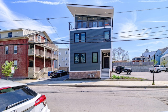 156 Oxford St, Portland, ME 04101 - townhome / multi-family property featuring brick siding and entry steps