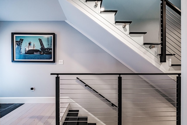 156 Oxford St, Portland, ME 04101 - staircase with wood finished floors and baseboards