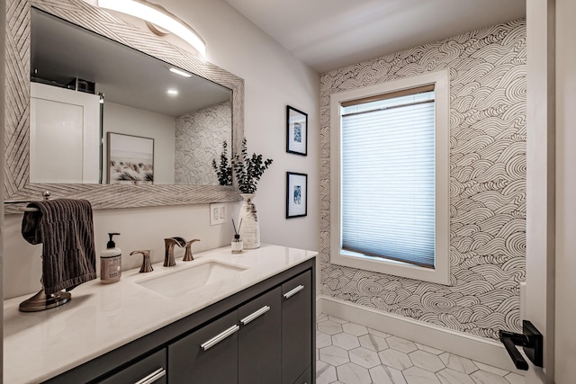 156 Oxford St, Portland, ME 04101 - bathroom with vanity, wallpapered walls, baseboards, and tile patterned flooring