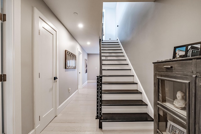 156 Oxford St, Portland, ME 04101 - staircase with wood finished floors, recessed lighting, and baseboards