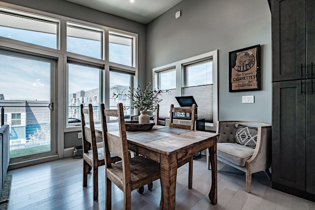 156 Oxford St, Portland, ME 04101 - dining room featuring light wood-style flooring, recessed lighting, and a high ceiling