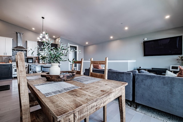 156 Oxford St, Portland, ME 04101 - dining area featuring light wood-type flooring, a chandelier, recessed lighting, and lofted ceiling