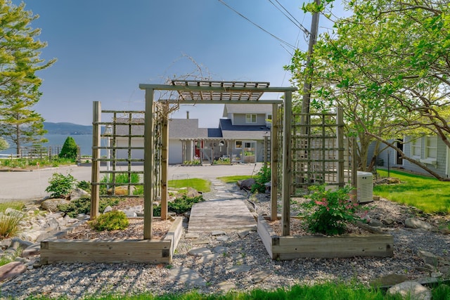 463 Seawall Rd, Southwest Harbor, ME 04679 - view of yard featuring a pergola and a vegetable garden