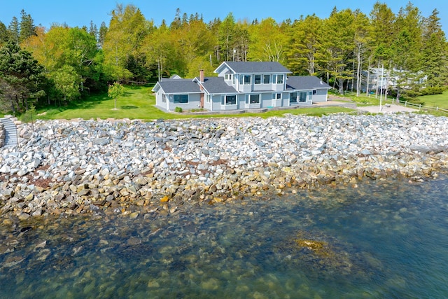 463 Seawall Rd, Southwest Harbor, ME 04679 - rear view of house featuring a yard, a wooded view, and a water view