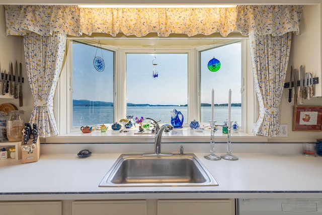 463 Seawall Rd, Southwest Harbor, ME 04679 - kitchen featuring dishwasher, a water view, and light countertops