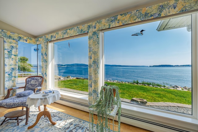 463 Seawall Rd, Southwest Harbor, ME 04679 - sunroom / solarium with wallpapered walls, a water view, and wood finished floors