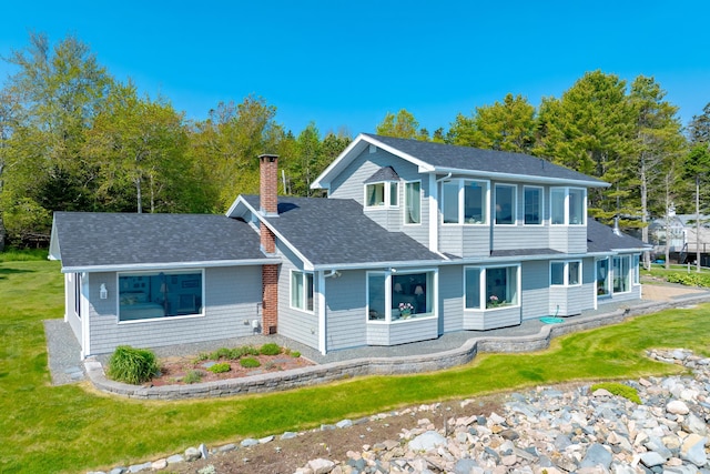 463 Seawall Rd, Southwest Harbor, ME 04679 - view of front facade featuring a shingled roof, a chimney, and a front lawn