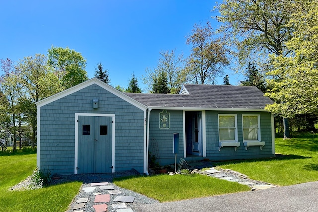463 Seawall Rd, Southwest Harbor, ME 04679 - view of front of home with a front lawn and a shingled roof