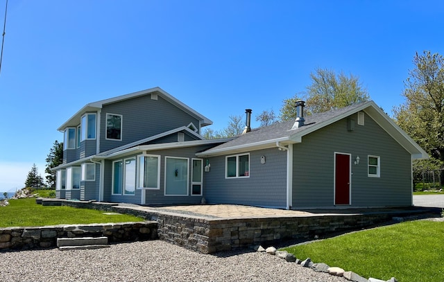 463 Seawall Rd, Southwest Harbor, ME 04679 - back of house with a patio area, a lawn, and roof with shingles