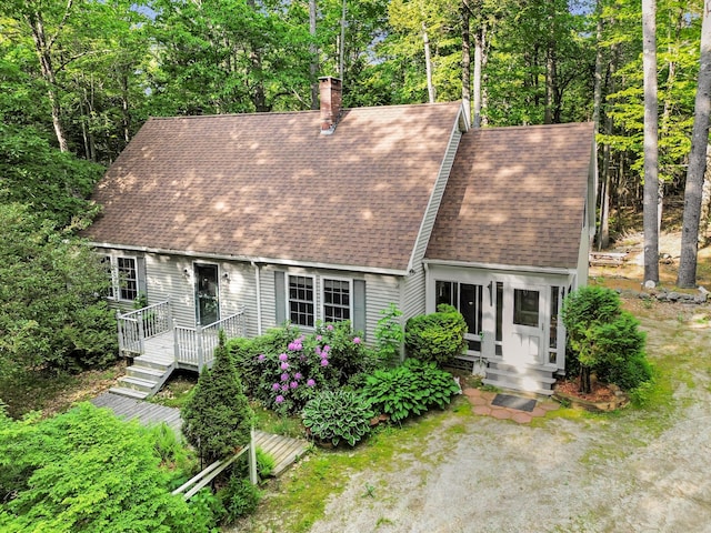 21 Heritage Ln, Orland, ME 04472 - view of front of home with roof with shingles, a chimney, and a wooden deck
