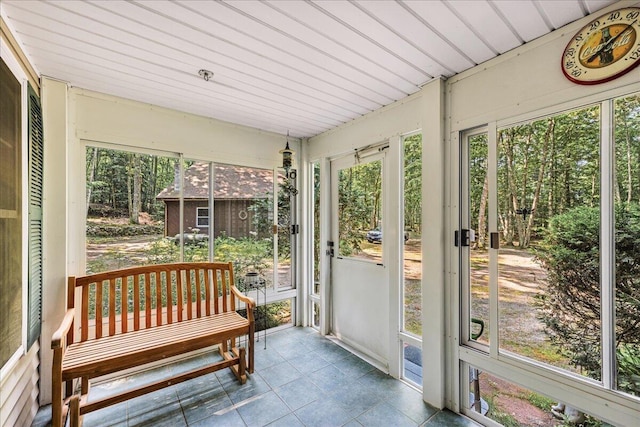 21 Heritage Ln, Orland, ME 04472 - sunroom featuring tile patterned floors