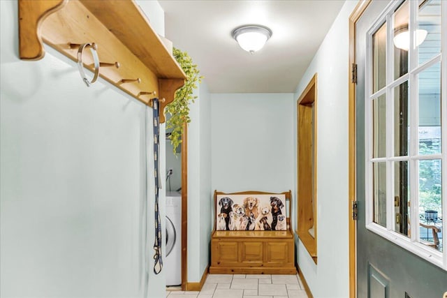 21 Heritage Ln, Orland, ME 04472 - laundry room with washer / dryer and light tile patterned floors