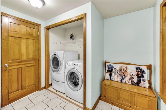 21 Heritage Ln, Orland, ME 04472 - laundry area with washer and clothes dryer and light tile patterned floors