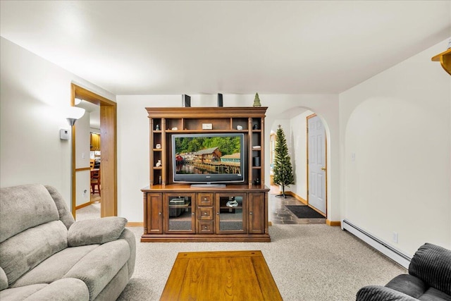 21 Heritage Ln, Orland, ME 04472 - living area featuring baseboard heating, arched walkways, and carpet