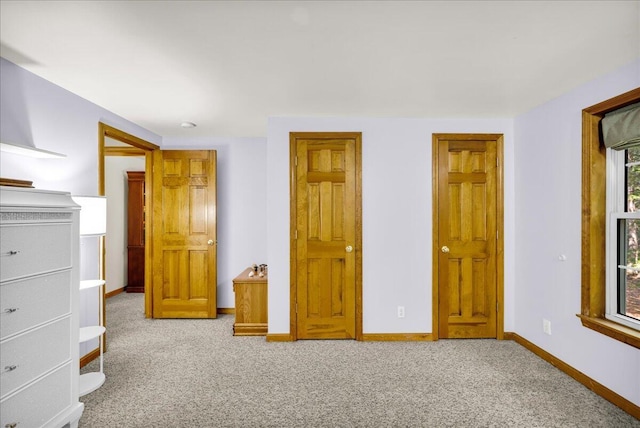 21 Heritage Ln, Orland, ME 04472 - unfurnished bedroom featuring carpet and baseboards