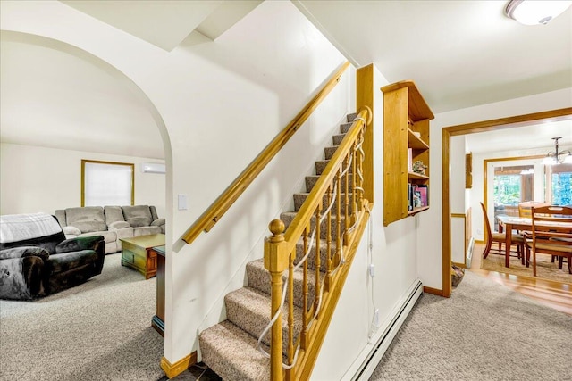 21 Heritage Ln, Orland, ME 04472 - stairs featuring carpet flooring, arched walkways, and baseboard heating