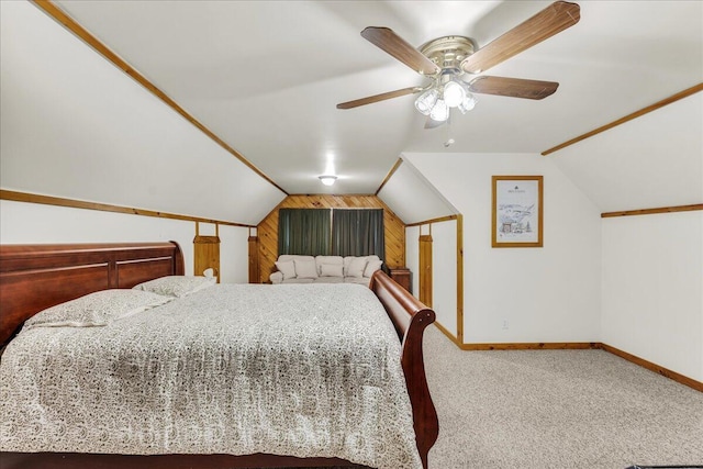 21 Heritage Ln, Orland, ME 04472 - bedroom with wooden walls, vaulted ceiling, carpet floors, and ceiling fan