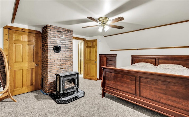 21 Heritage Ln, Orland, ME 04472 - bedroom with a wood stove, carpet flooring, ceiling fan, and lofted ceiling