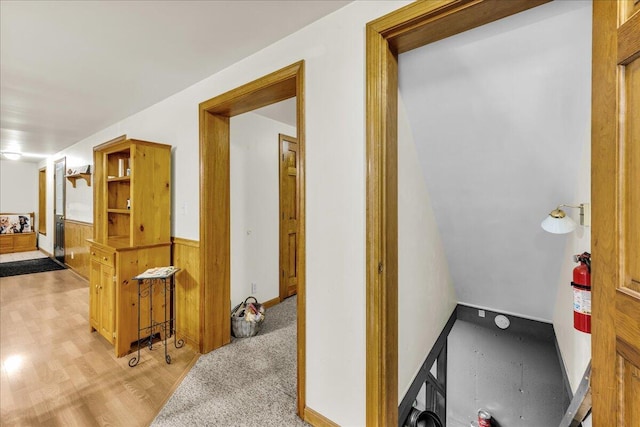 21 Heritage Ln, Orland, ME 04472 - corridor with wainscoting and light wood-style flooring