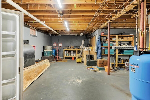21 Heritage Ln, Orland, ME 04472 - unfinished basement featuring a water pressure tank