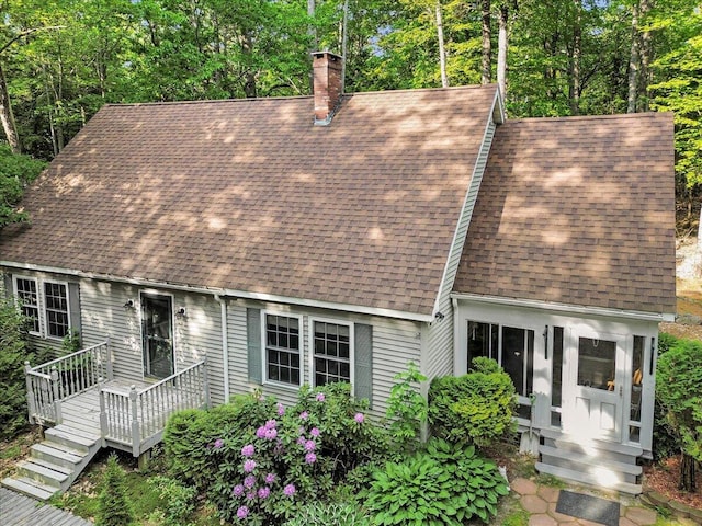 21 Heritage Ln, Orland, ME 04472 - new england style home with roof with shingles, a chimney, and a deck