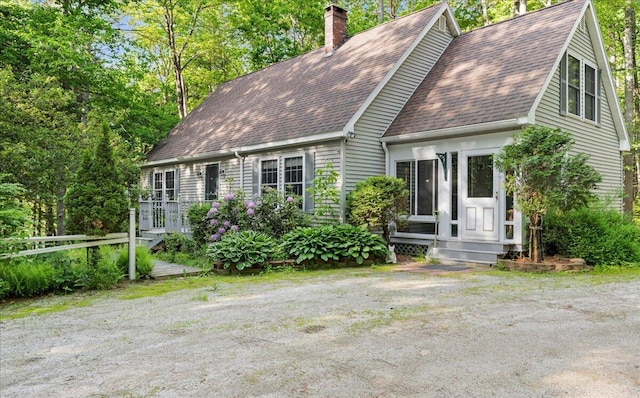 21 Heritage Ln, Orland, ME 04472 - view of front of property featuring roof with shingles and a chimney