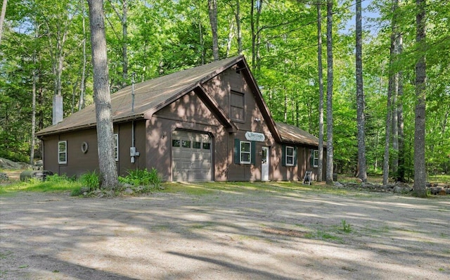 21 Heritage Ln, Orland, ME 04472 - rustic home featuring a garage