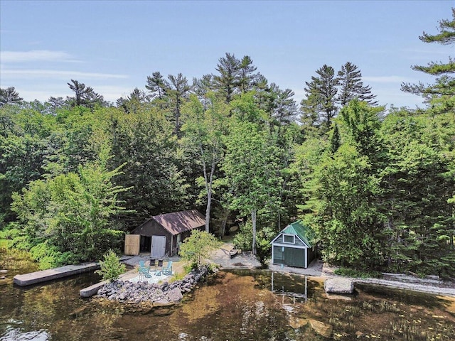 21 Heritage Ln, Orland, ME 04472 - view of yard with a storage unit and a forest view