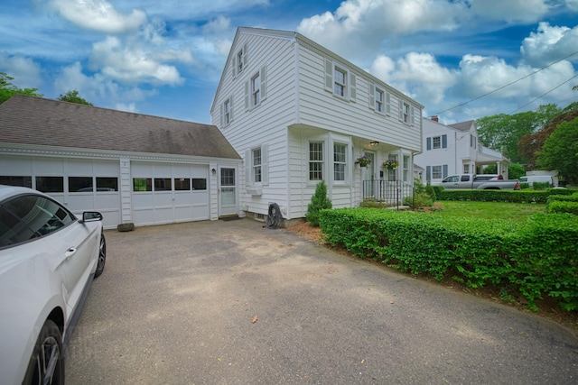 42 Sylvan Rd, South Portland, ME 04106 - view of property exterior featuring a garage and driveway